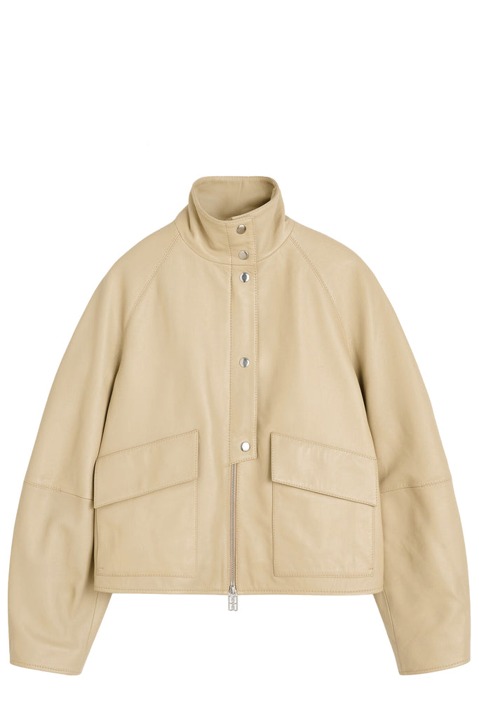 By Malene Birger jacket in beige with patents, zipper and pockets, shown against a plain white background.
