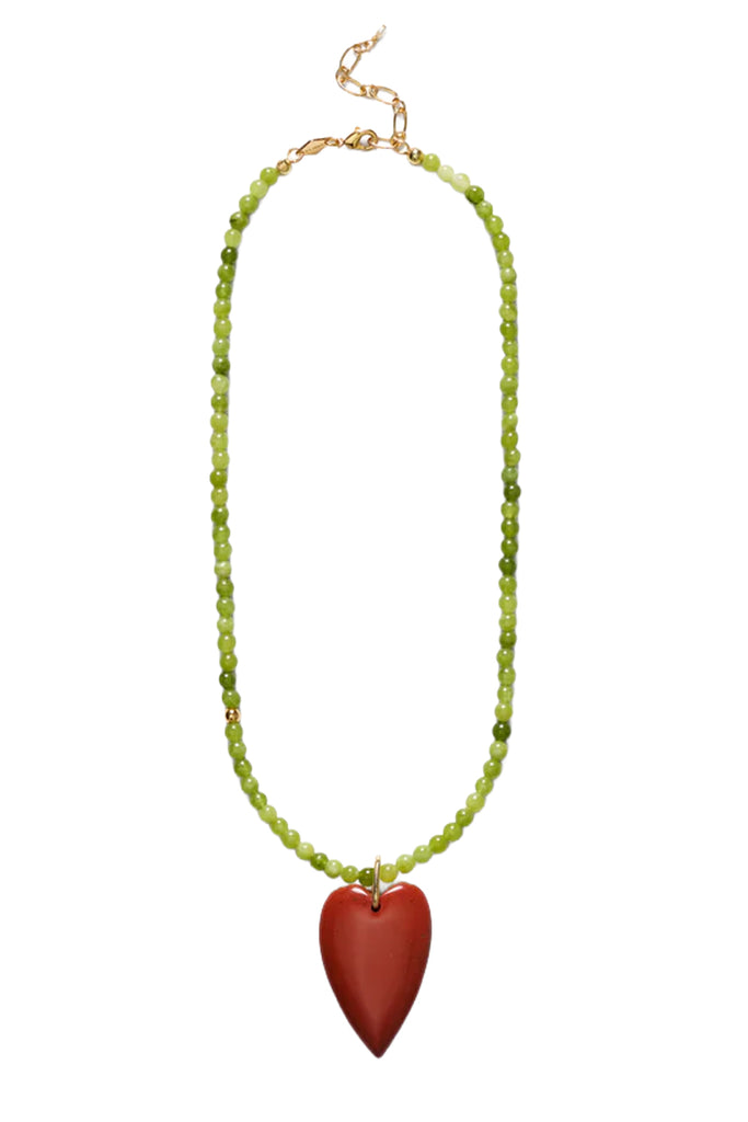 A beaded necklace featuring light green faceted beads and a large, smooth, matte reddish-brown heart-shaped pendant, displayed on a clean white background.