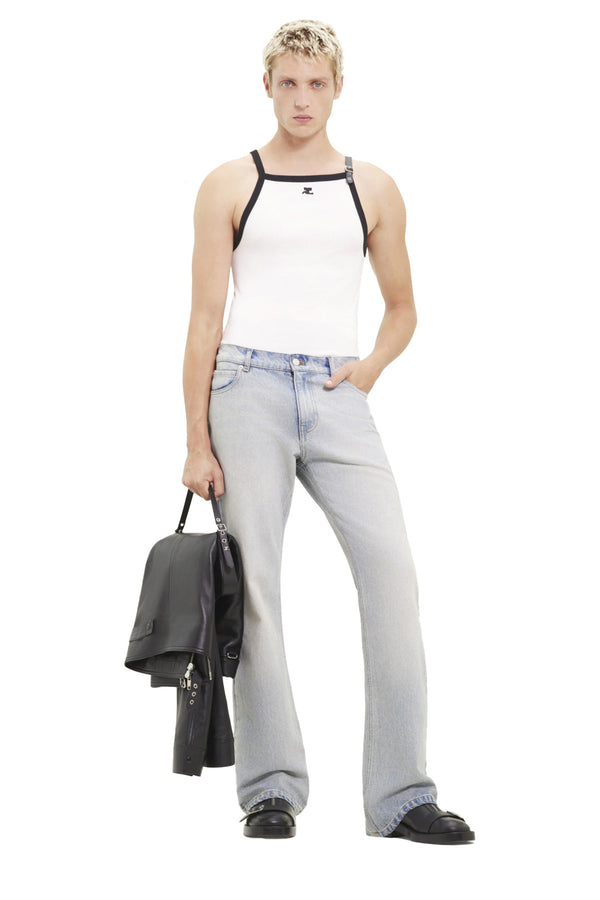 Model wearing the Buckle-Detail Contrast-Trim Tank Top in white and black colour from the brand COURRÈGES