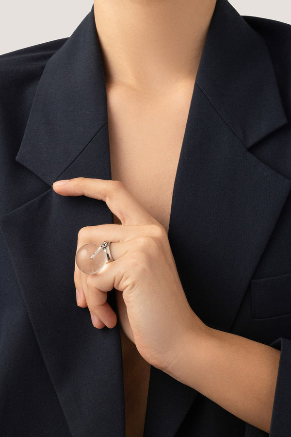 Model wearing the Lyra ring in silver and clear colours from the brand JENNY BIRD