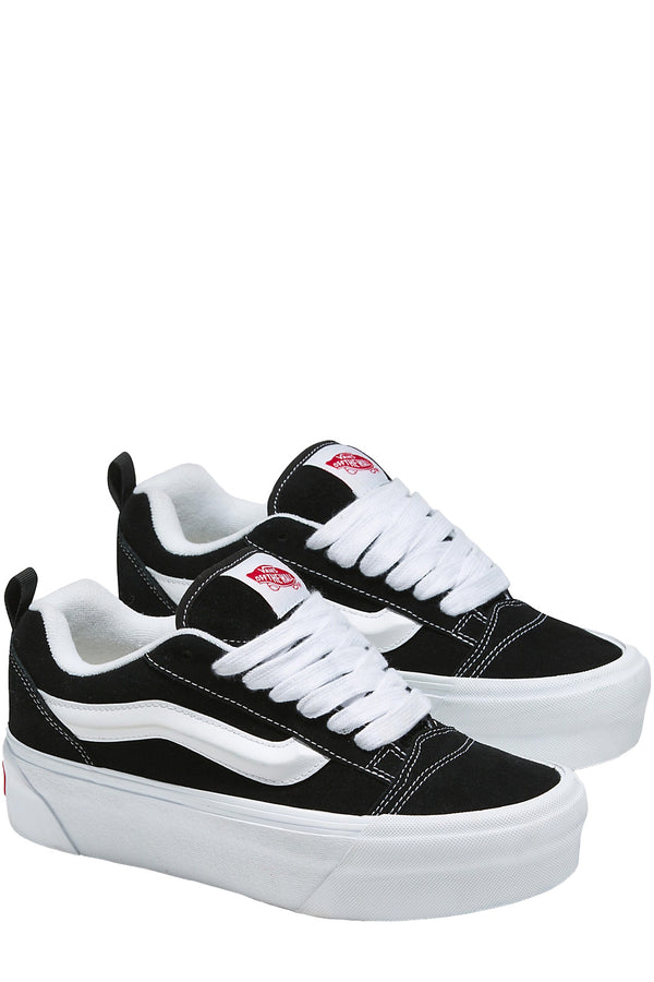 The Knu stack sneakers in black and white colours from the brand VANS