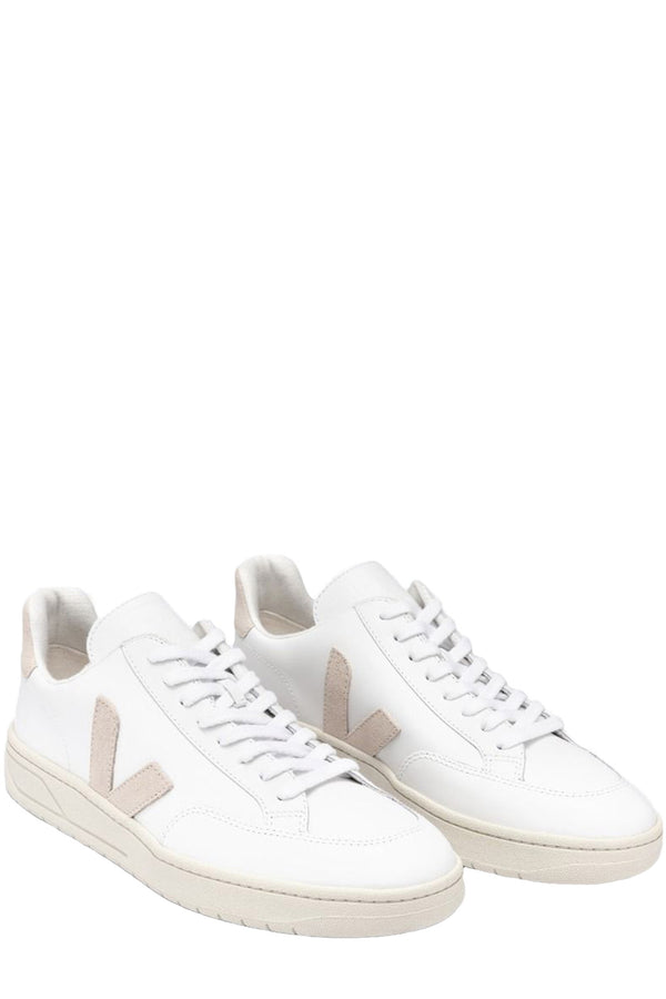 The V-12 leather sneakers in extra white and sable colors from the brand VEJA