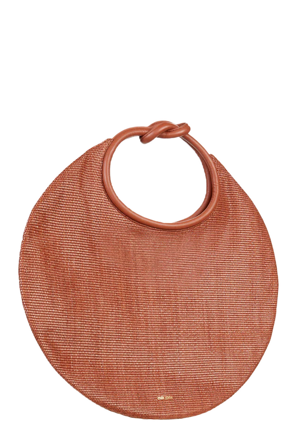 The Adina circular raffia bag in dark brown color from the brand CULT GAIA