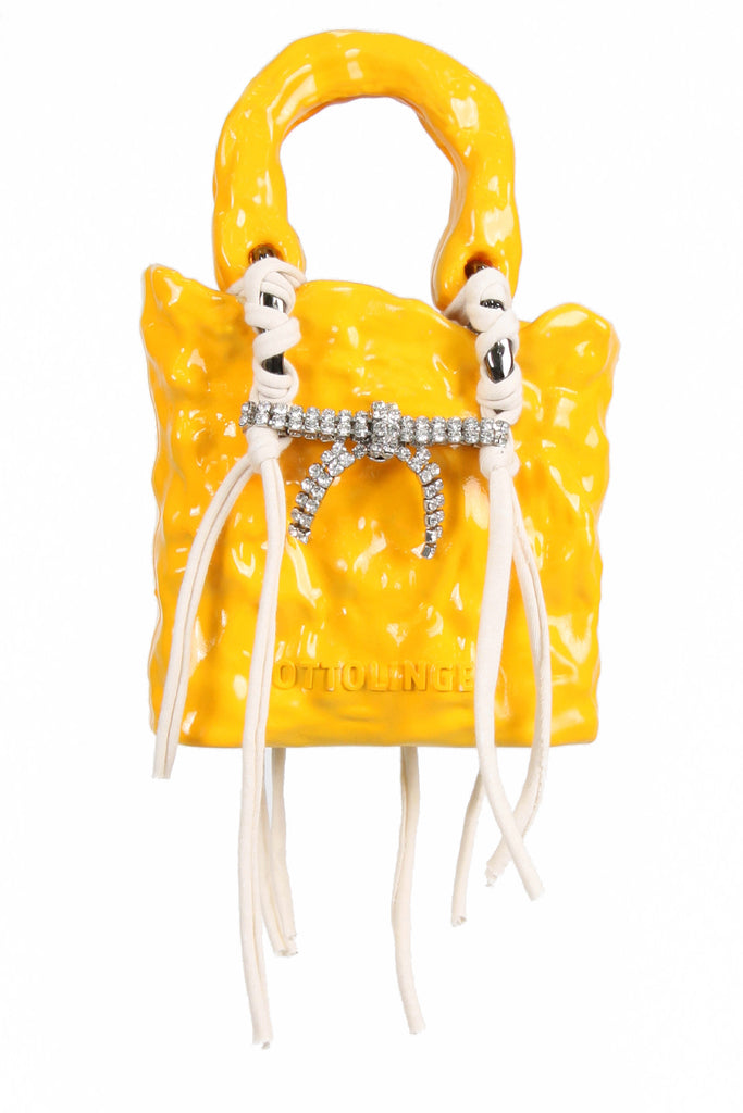 The Ottolinger signature handpainted ceramic bag in sun flower color from the brand OTTOLINGER